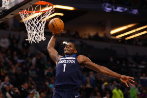 Anthony Edwards rises up for a dunk against the Houston Rockets.