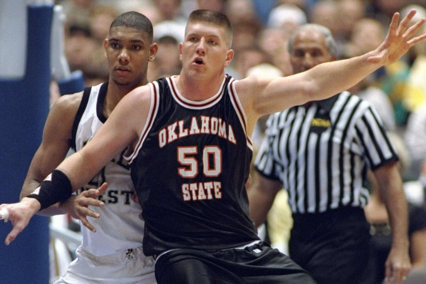 Oklahoma State's Bryant Reeves battles in the post with Wake Forest's Tim Duncan.