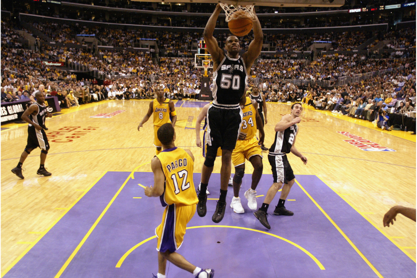 David Robinson dunks against the Los Angeles Lakers in 2003.