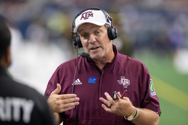 Jimbo Fisher Talks on Headset During Arkansas Game