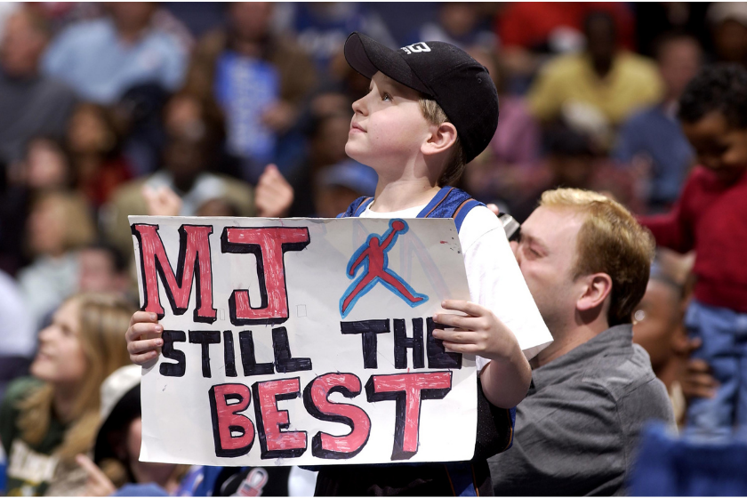 A fan holds up a Michael Jordan sign during a game