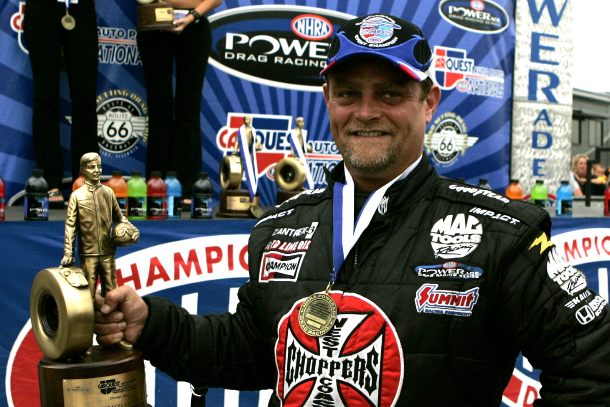 Scott Kalitta holding trophy in the Winner Circle at the Route 66 Raceway, Joliet Illinois on June 12, 2005