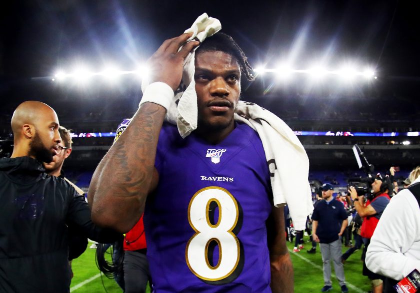 Lamar Jackson walks off the field after losing to the Titans in the 2020 NFL Playoffs.