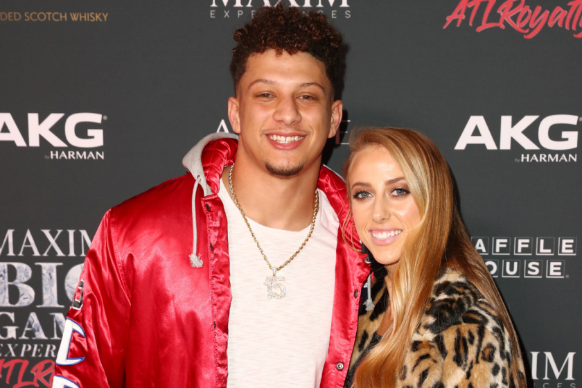 Patrick Mahomes and Brittany pose for a picture.