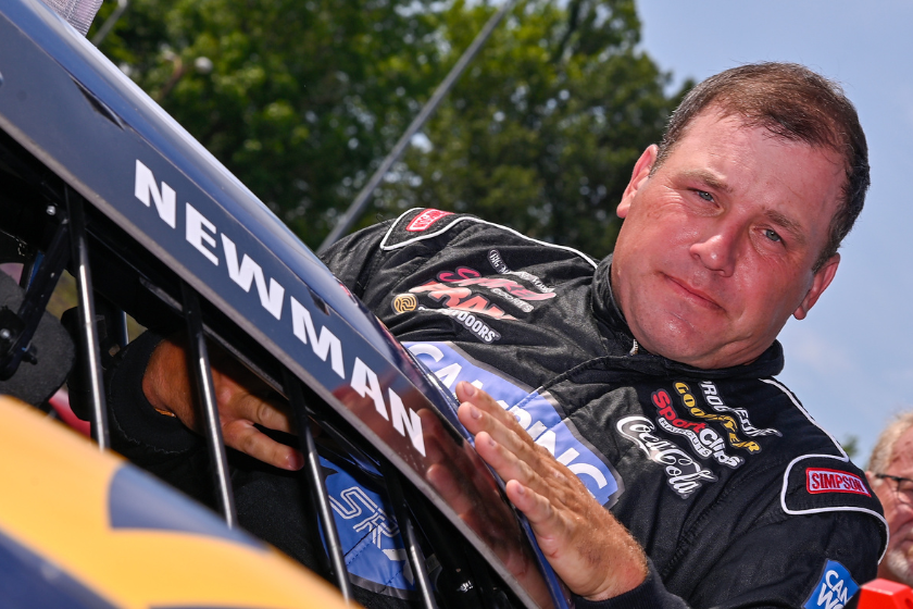 Ryan Newman climbs in his car before practice at a Camping World Superstar Racing Experience at I-55 Raceway on July 16, 2022 in Pevely, Missouri
