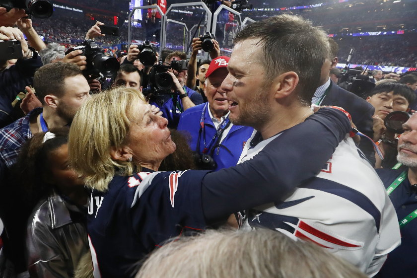 Tom Brady #12 of the New England Patriots hugs his mother Galynn after the Patriots defeat the Los Angeles Rams 13-3 during Super Bowl LIII at Mercedes-Benz Stadium