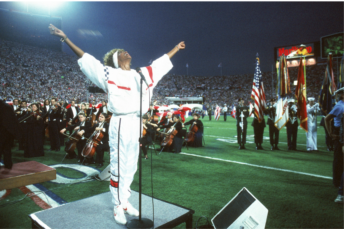 Whitney Houston sings the National Anthem before Super Bowl XXV.
