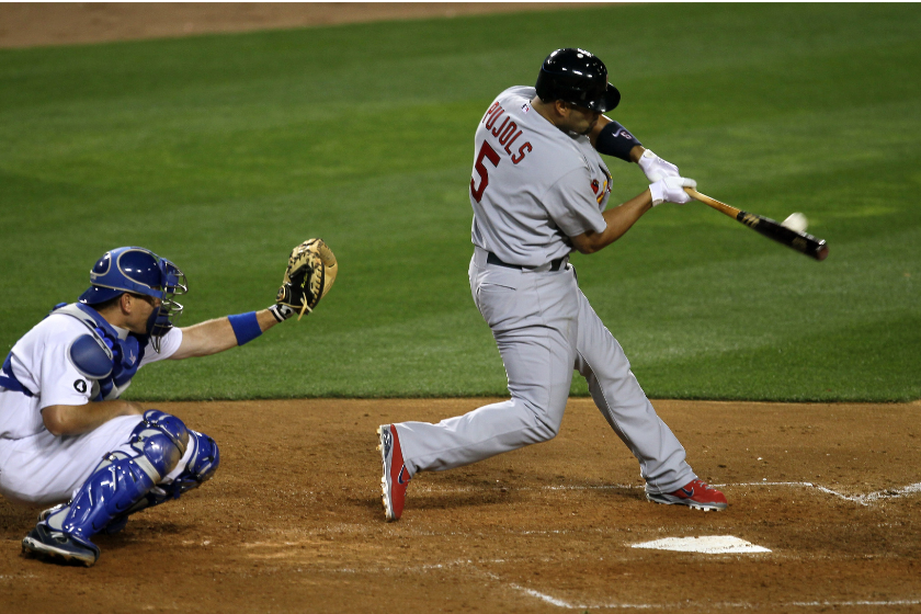 Albert Pujols of the St Louis Cardinals hits a home run in the fifth inning against the Los Angeles Dodgers