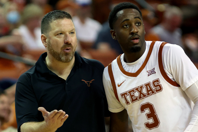 Texas head coach Chris Beard instructs his player against West Virginia.