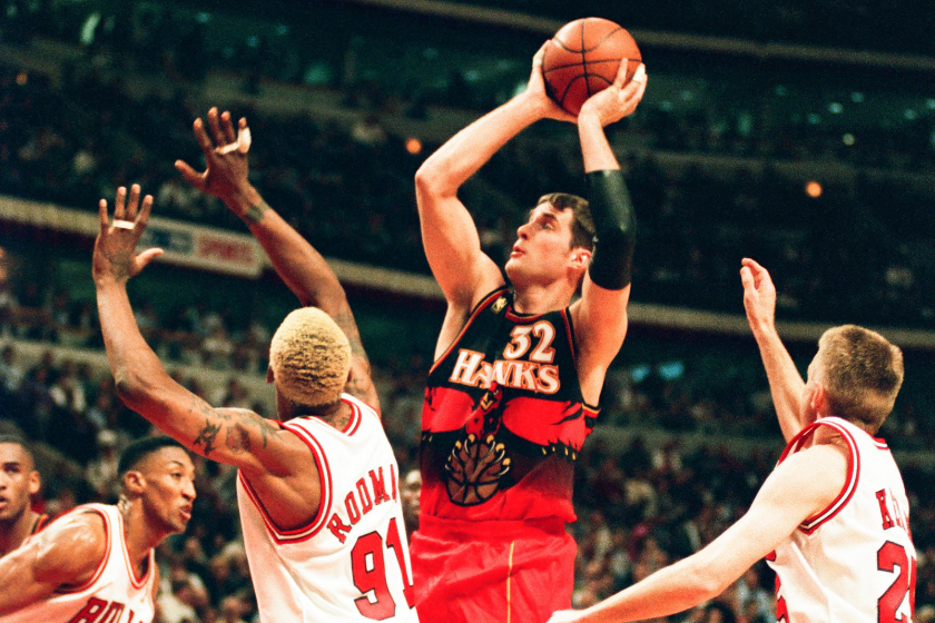 Christian Laettner of the Atlanta Hawks shoots against Dennis Rodman of the Chicago Bulls during the game on May 13, 1997 at The Omni Coliseum 