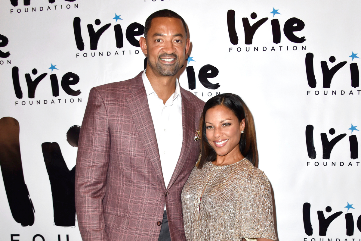 Juwan Howard and Jenine Howard pose for a picture together.