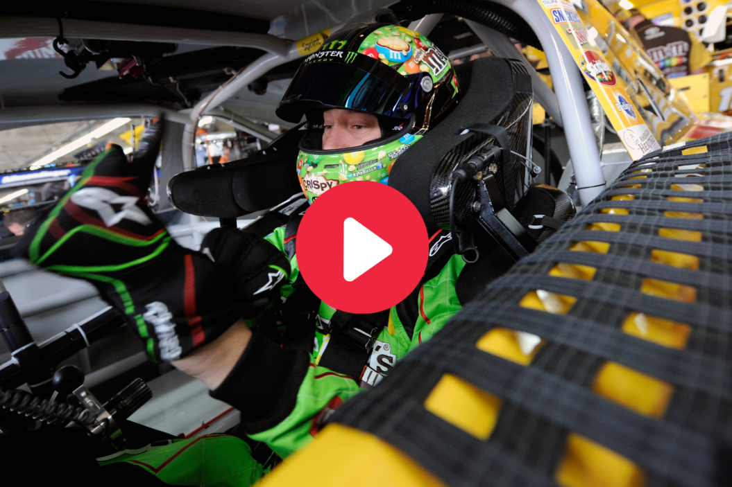 Kyle Busch sits in his car during practice for the 2015 All-Star Race at Charlotte Motor Speedway