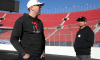 Kyle and Kurt Busch walk the track prior to practice for the NASCAR Cup Series Busch Light Clash at Los Angeles Coliseum on February 05, 2022