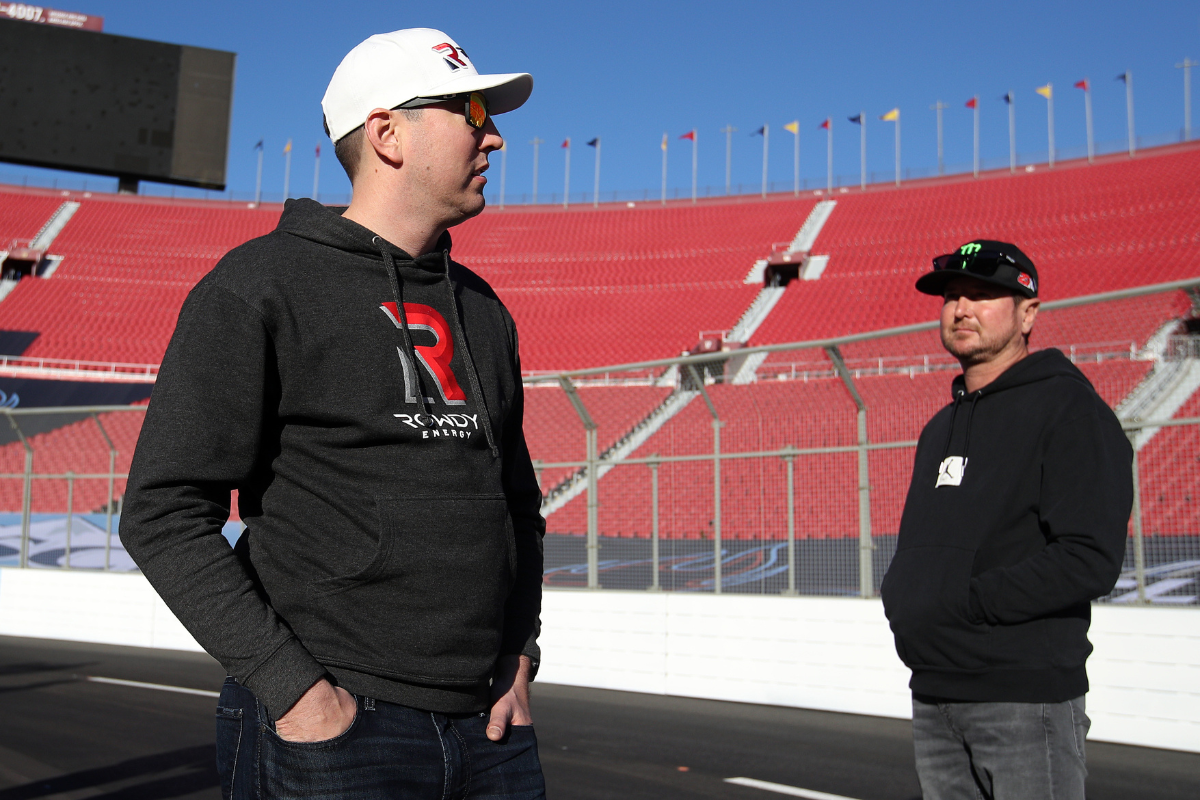 Kyle and Kurt Busch walk the track prior to practice for the NASCAR Cup Series Busch Light Clash at Los Angeles Coliseum on February 05, 2022