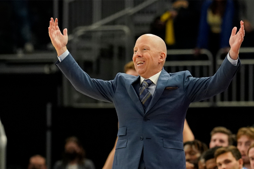 UCLA head coach Mick Cronin happily reacts againt Marquette.