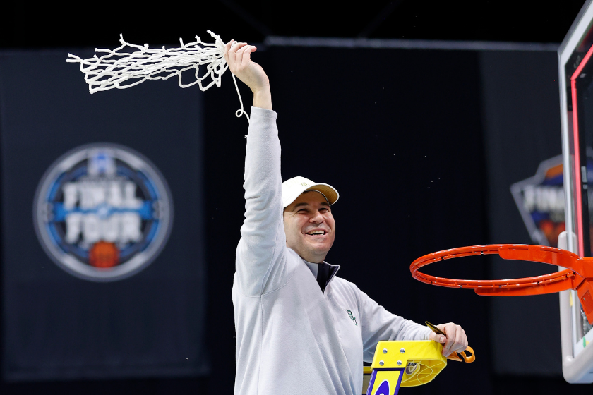 Head coach Scott Drew of the Baylor Bears cuts down the nets after defeating the Gonzaga Bulldogs in the National Championship game of the 2021 NCAA Men's Basketball Tournament at Lucas Oil Stadium 