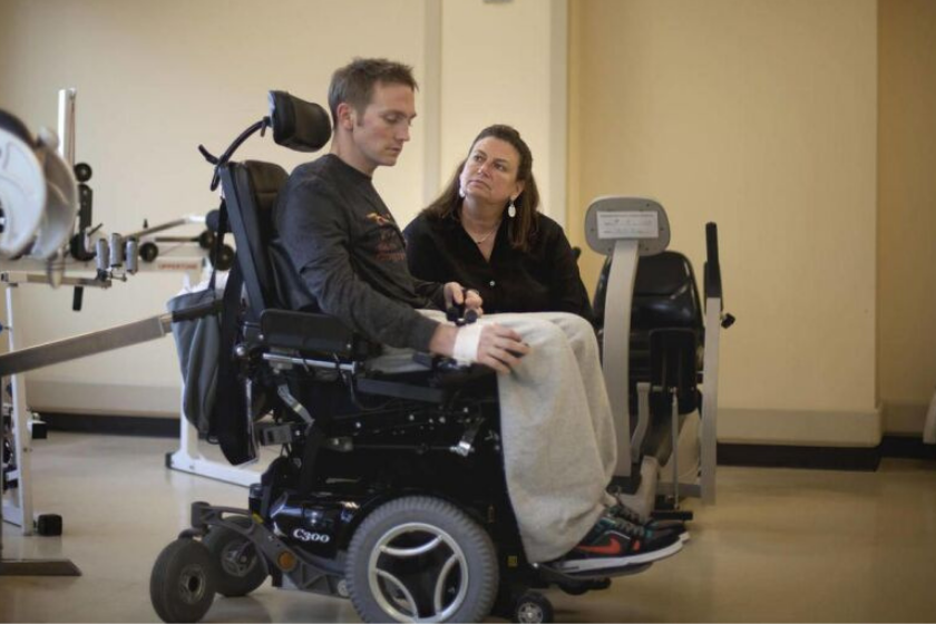 shane hmiel in wheelchair during physical therapy
