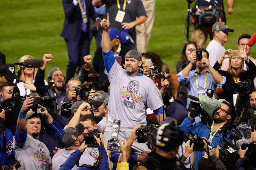David Ross lifted up by his Cubs teammates.