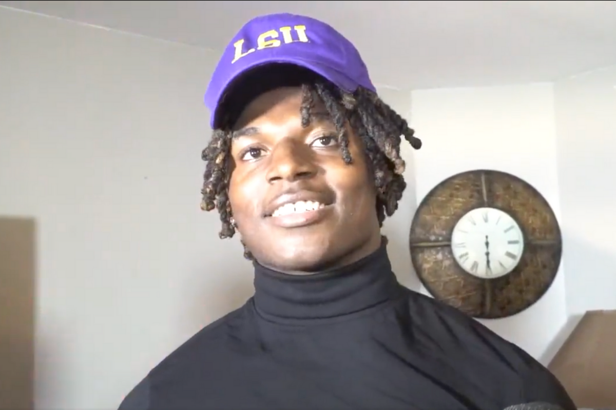 Harold Perkins smiles after making his commitment to LSU.
