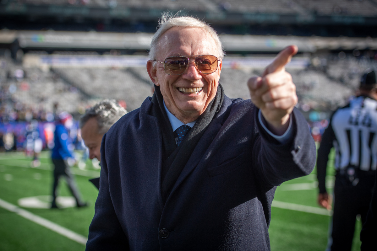 Dallas Cowboys owner Jerry Jones on the field reacting to fans before a game against the New York Giants at MetLife Stadium