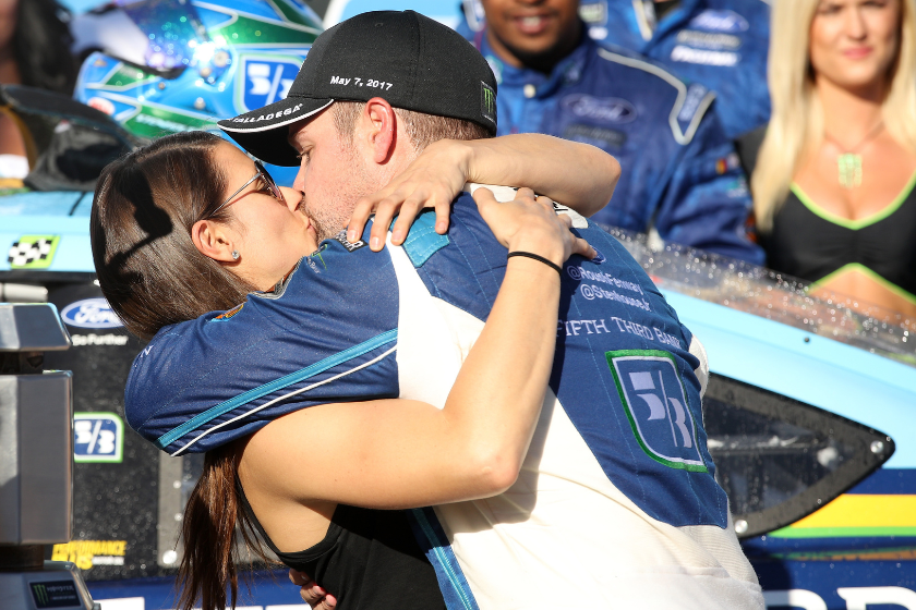 Ricky Stenhouse kisses Danica Patrick in Victory Lane after he won the 2017 GEICO 500