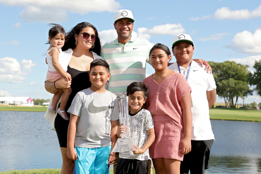 Tony Finau of the United States and his wife Alayna Finau pose with their children after Finau won the 3M Open at TPC Twin Cities
