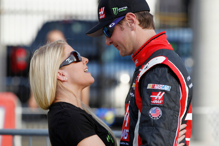 Kurt Busch stands on the grid with his then girlfriend, Patricia Driscoll, during qualifying for the NASCAR Sprint Cup Series Coca-Cola 600 at Charlotte Motor Speedway on May 22, 2014 in Charlotte, North Carolina
