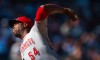 Aroldis Chapman #54 of the Cincinnati Reds pitches during the game against the New York Yankees
