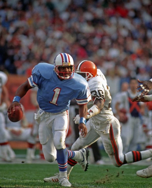 Warren Moon scrambles against the Browns in 1989.