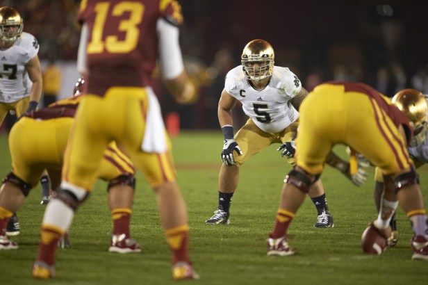 Notre Dame linebacker lines up before a play against USC.