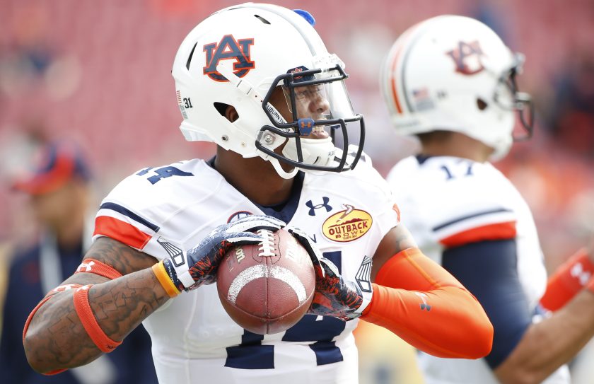Nick Marshall warms up before the start of the Outback Bowl against the Wisconsin Badgers in 2015.