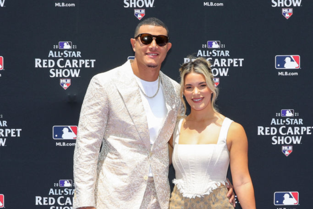 Manny Machado #13 of the San Diego Padres is seen with his wife, Yainee Alonso during the MLB All-Star Red Carpet Show