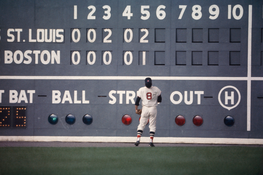 Red Sox outfielder Carl Yastrzemski #8 stares at the "green monster", the 37' tall left field wall at Fenway Park during the 1967 World Series against the St. Louis Cardinals