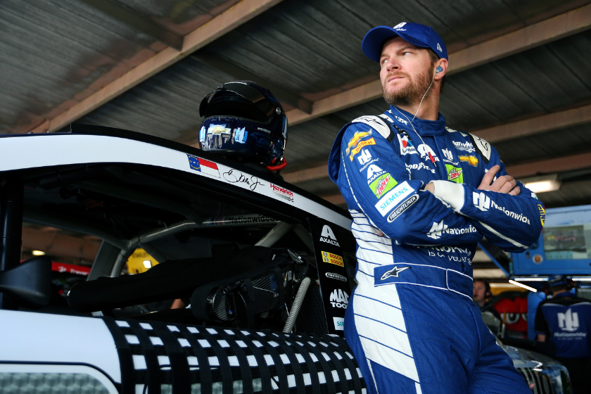 Dale Earnhardt Jr stands in the garage area during practice for the 2017 Apache Warrior 400 at Dover International Speedway