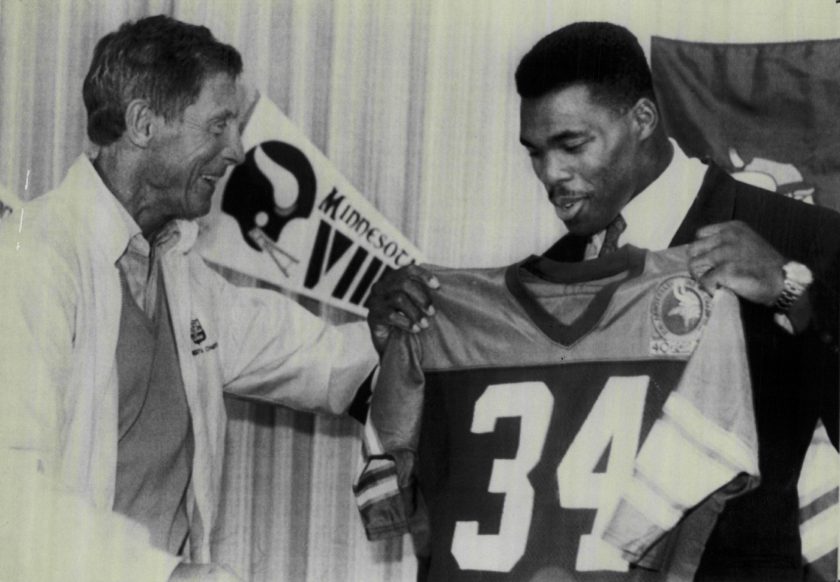 Minnesota Vikings coach Jerry Burns greets Herschel Walker in 1989.