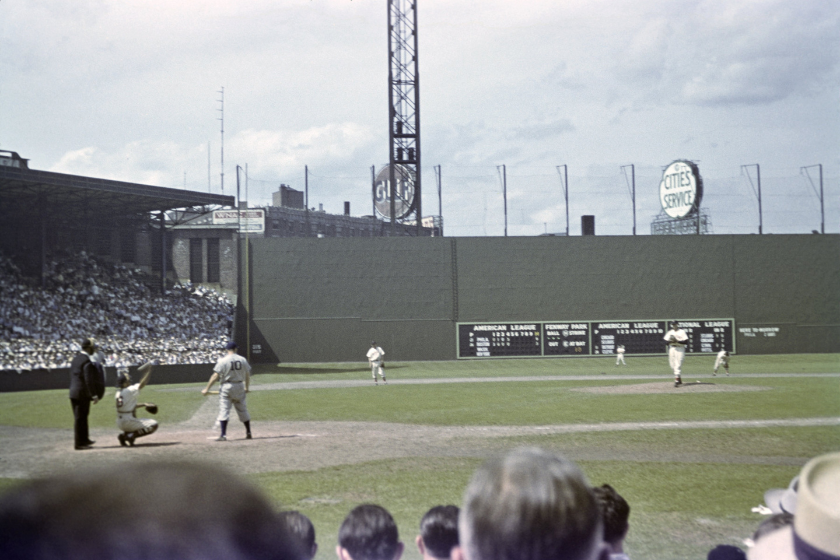 Outfielder Elmer Valo #10 of the Philadelphia A's stands at the plate as catcher Roy Partee #16 of the Boston Red Sox relays the ball to the pitcher in the top of the fifth inning of a game on July 3, 1947 at Fenway Park