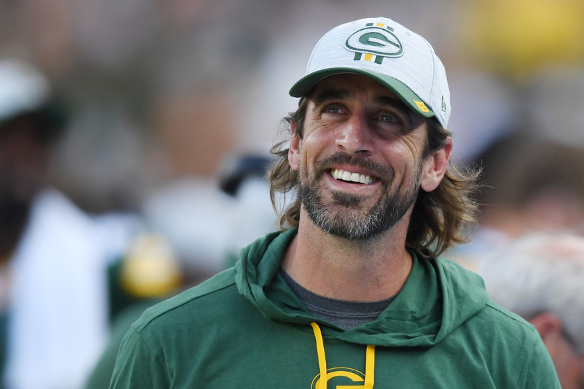Green Bay Packers quarterback Aaron Rodgers smiles during a 2021 preseason game.