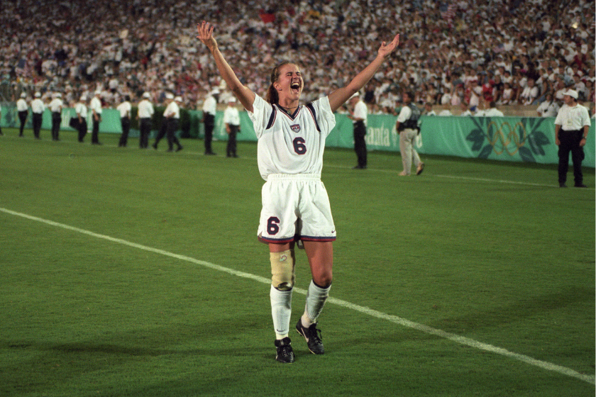 Brandi Chastain gestures to the crowd at the 1996 Summer Olympics in Atlanta