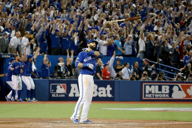 Toronto Blue Jays outfielder Jose Bautista tosses his bat after hitting a three-run home run in game 5 of the 2014 ALDS.