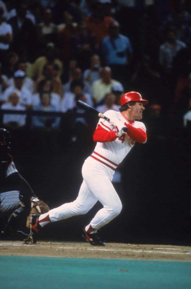 Pete Rose connects with a pitch against the San Diego Padres in 1985.