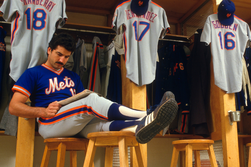 Keith Hernandez reads the paper in the Mets Clubhouse at Shea Stadium