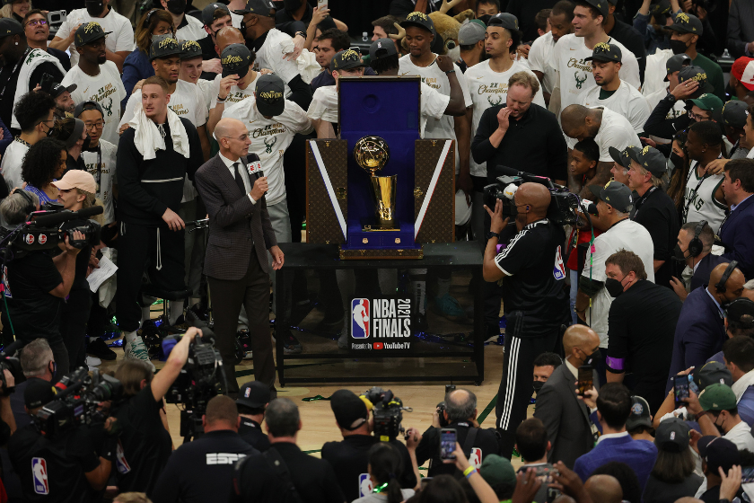 NBA Commissioner Adam Silver presents the Larry O'Brien Trophy to the Milwaukee Bucks.