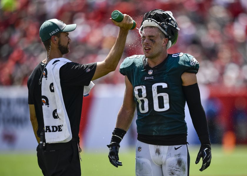 Eagles tight end Zach Ertz is hosed down by a water boy during a 2018 game.