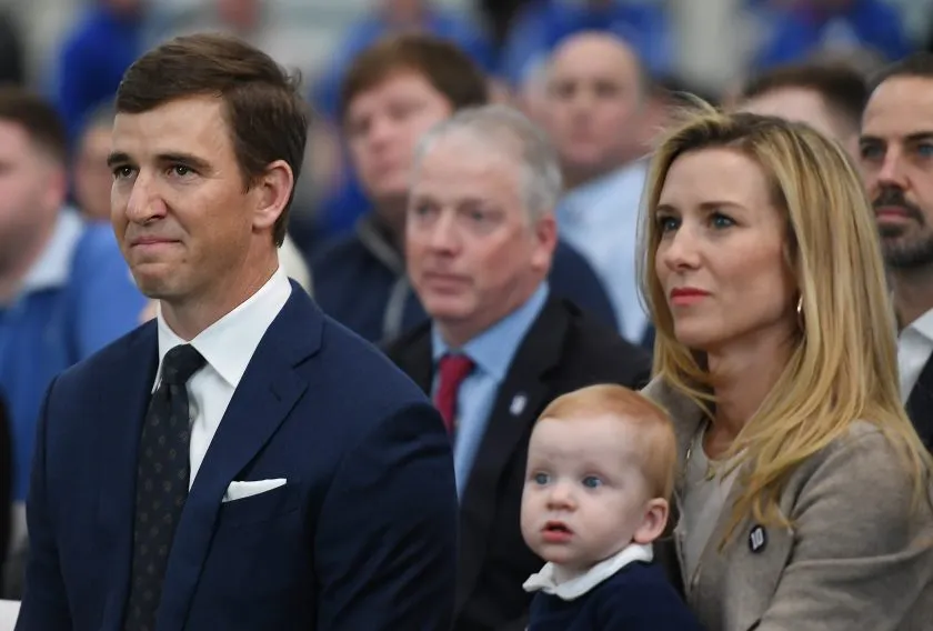 Eli Manning and wife Abby during his retirement press conference.
