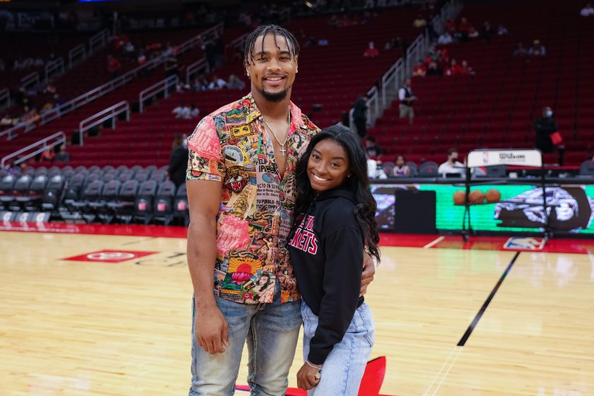 Simone Biles and Jonathan Owens attend a game between the Houston Rockets and the Los Angeles Lakers at Toyota Center on December 28, 2021.