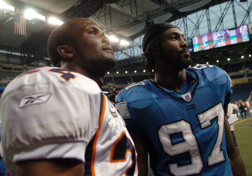 Champ and Boss Bailey take a picture after a 2007 game.