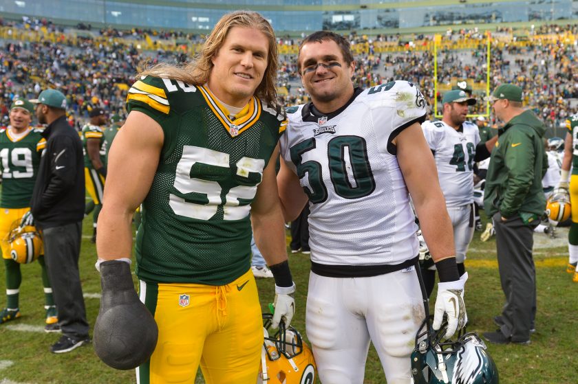 Clay Matthews and Casey Matthews pose after a 2013 NFL game.