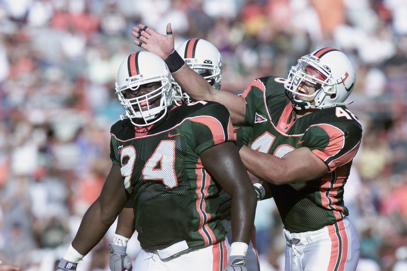 A Miami player is smacked on the head during a 2001 game.