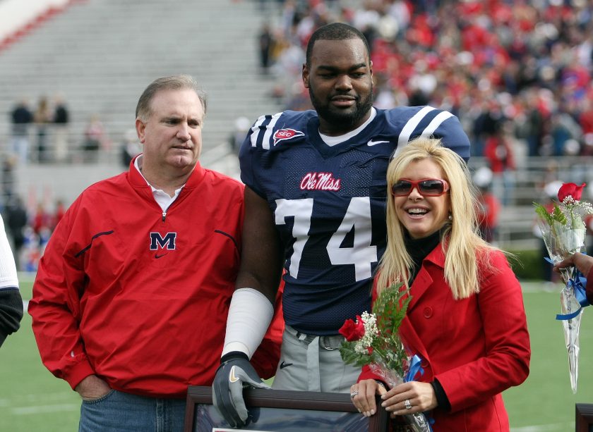 Michael Oher stands with his family during senior ceremonies prior to a game against the Mississippi State Bulldogs at Vaught-Hemingway Stadium in 2008.