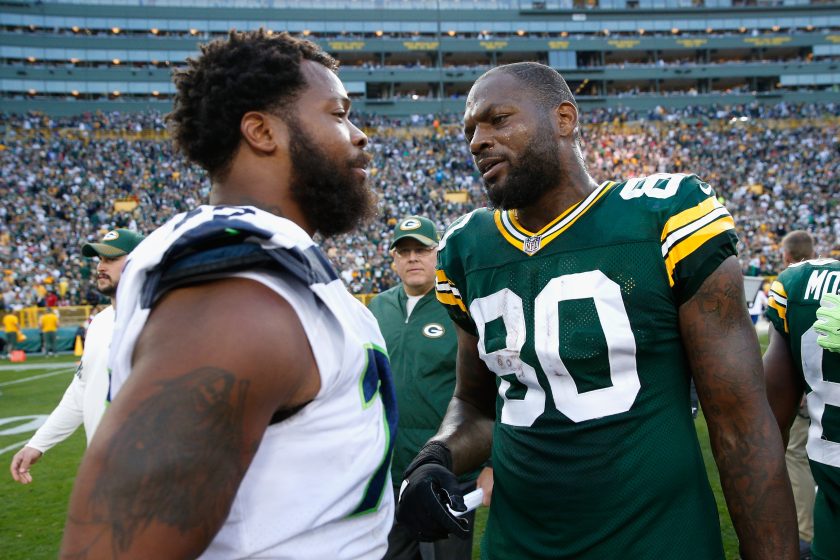Michael and Martellus Bennett talk after a 2017 NFL game.